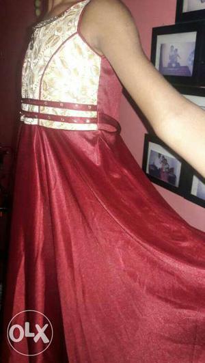 Person's Red And Beige Satin Dress