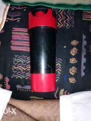 Red And Black Plastic Bottle