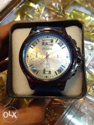 Round Grey Fexex Chronograph Watch With Blue Leather Band In