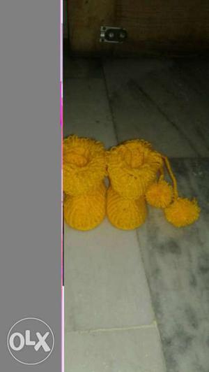 Two Yellow Knitted Boots