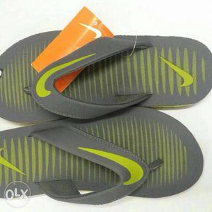 Pair Of Green-and-gray Nike Flip Flops