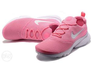 Pair Of Pink-and-white Nike Low Top Sneakers
