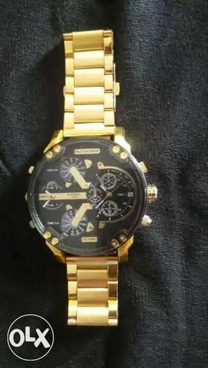 Round Black Chronograph Watch With Gold Link Bracelet