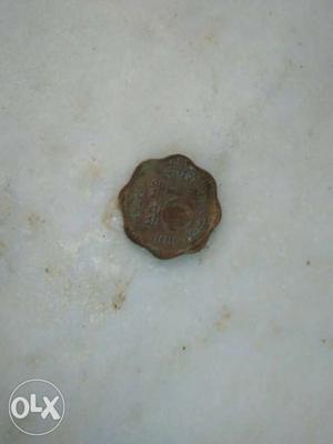 Scalloped Edge And Round Copper Coin