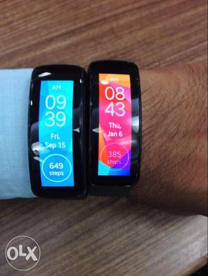 Two Black Fitbit Watches