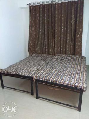 2 single beds with metal frame, plywood base and mattress