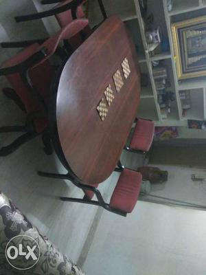 8 years old Teak wood dining table with 4 chairs.