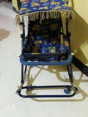 Baby's Blue And Yellow Stroller