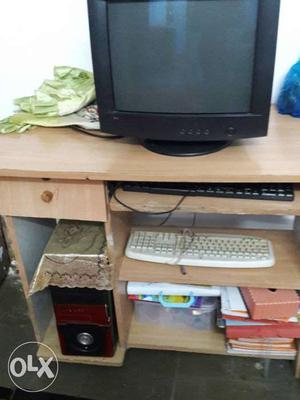 Black CRT Computer Monitor; Brown Wooden Computer Desk