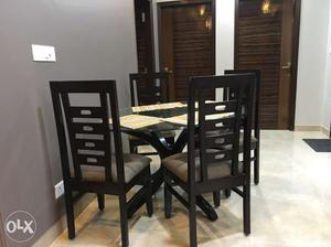 Dinning tabel with 4 chairs at throw away price.