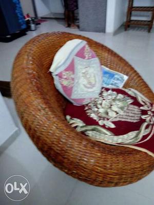 Red And White Floral Cushioned Chair With Wicker Chair