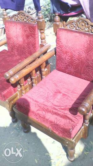 Two Brown Wood-framed Red Floral Padded Armchairs