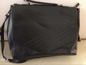 Black sling bag, good for office or college
