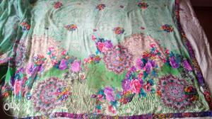 Green, Pink And Purple Floral Textile