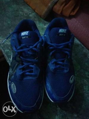 Pair Of Blue userd Nike Athletic Shoes