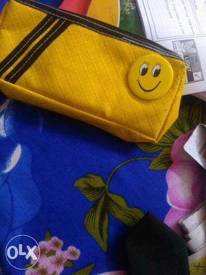 Very attractive pouch, yellow color, with a