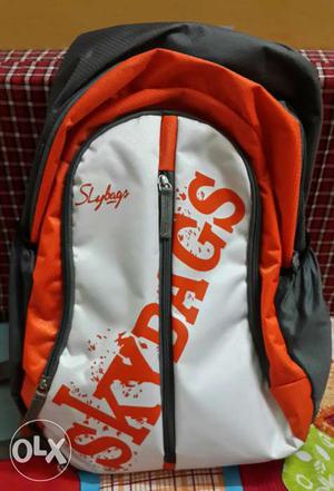 White, Orange, And Gray Skydags Backpack