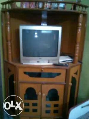 Brown Wooden TV Hutch With Gray CRT Television