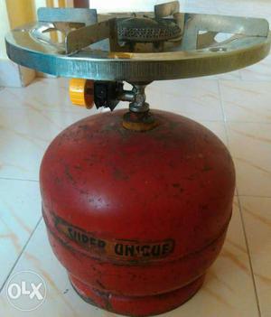 Red Single Burner Stove With Red Propane Tank