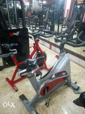 Two Gray And Red Stationary Bikes