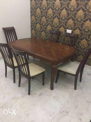 6 seat brown wooden dinning table in new condition antique