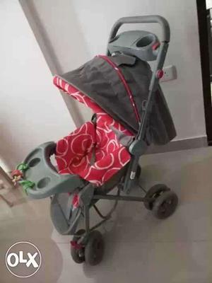Baby's Gray And Red Convertible Stroller