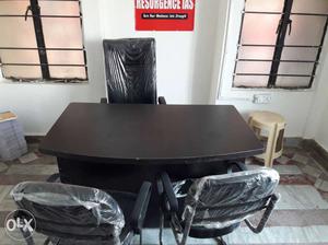 Black Wooden Office Desk With Three Chairs