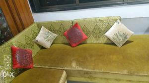 Brown Sectional Sofa And Four Throw Pillows