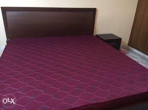 Brown Wooden bed from usha shri ram