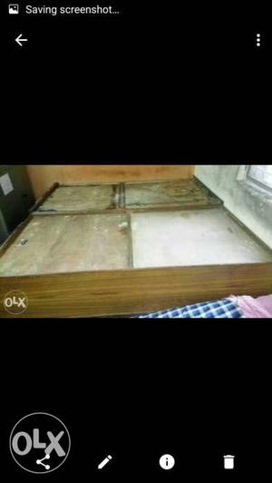 Brown wooden double bed with 4 box