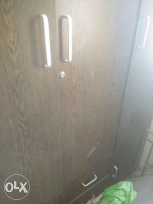 Cupboard, particle board. Less used. Urgent sale