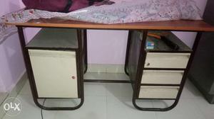 Iron table with wooden ply almost new condition.