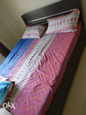 Queen size bed along with mattress and has been