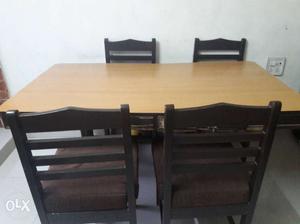 Solid Brown Wood Dining Table with a set 4