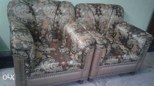 Two Gray-and-brown Floral Sofa Chairs