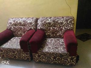 Two Red And White Floral Suede Sofa Chairs
