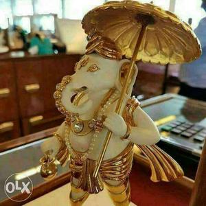 White And Gold-colored Ganesha Statuette