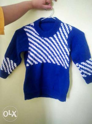 Baby's Blue And Knitted Sweater