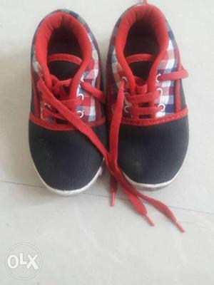 Black and red baby boys shoes of 1years old