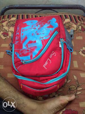 Blue And Red Sun Land Backpack
