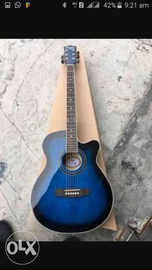 Blue Wooden Cutaway Acoustic Guitar Screenshot