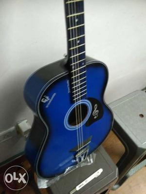 Blue and black acoustic guitar for sale, amazing