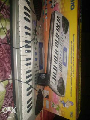 Gray Casio Electronic Keyboard With adapter