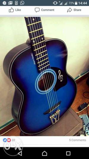 Hollow blue and black acoustic guitar, amazing