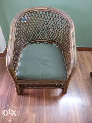 One Cane chair with cushion.