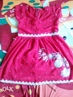 Red coloured knee length frock
