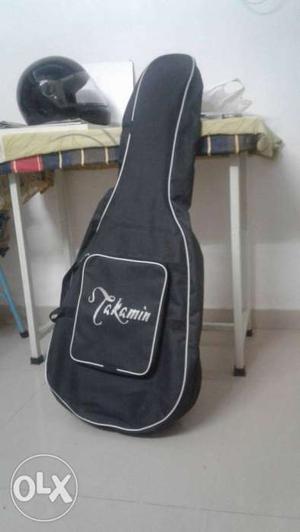 Takamin guitar with belt,cover and extra set of chords.