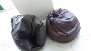 Two Brown And Black Bean Bag Chairs
