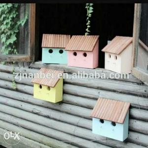 Five Blue, Pink, Yellow, And White Birdhouses