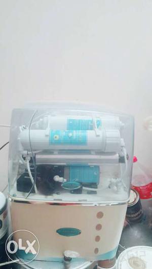 White, Brown And Teal Water Filtration System